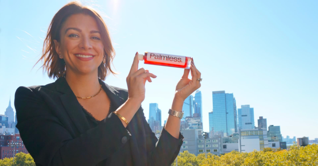 Shara Ticku, co-founder and CEO of C16 Biosciences holding a bottle of Palmess